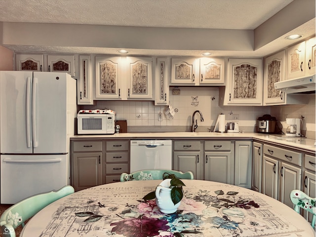 kitchen featuring gray cabinetry and white appliances