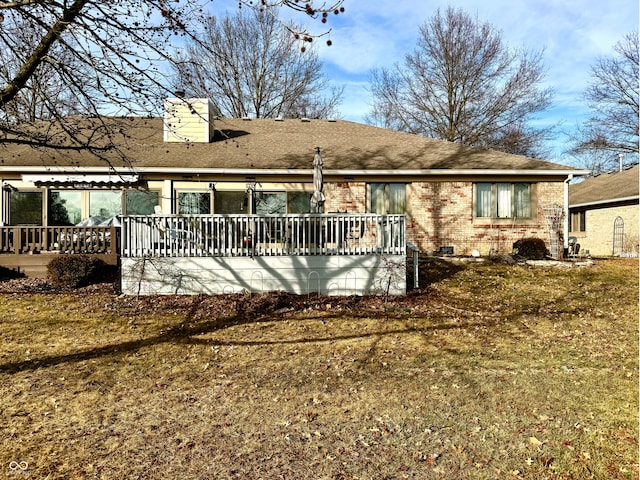 back of house featuring a yard and a deck