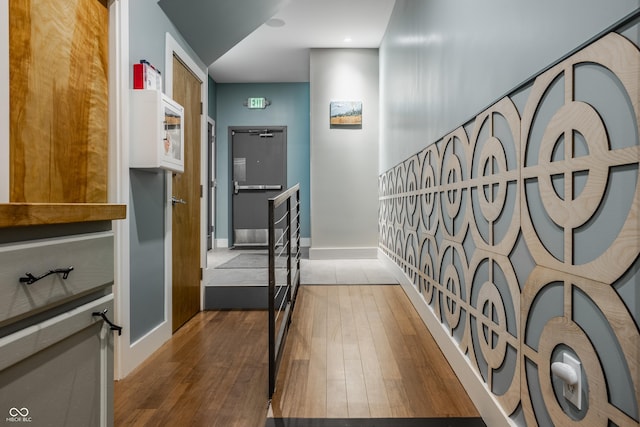 corridor with dark hardwood / wood-style floors