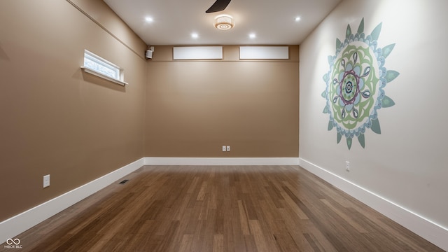 unfurnished room with hardwood / wood-style floors