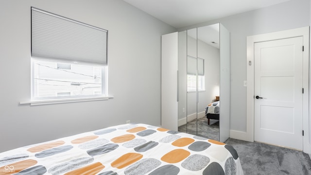 carpeted bedroom featuring a closet