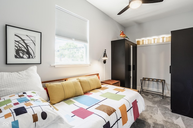 bedroom featuring light colored carpet and ceiling fan