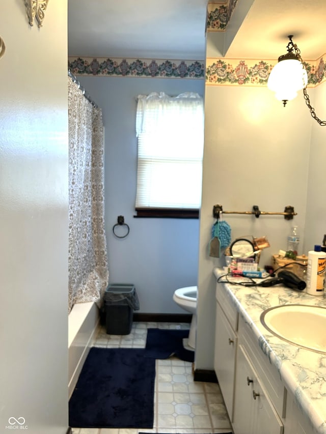 full bathroom featuring toilet, vanity, and shower / tub combo