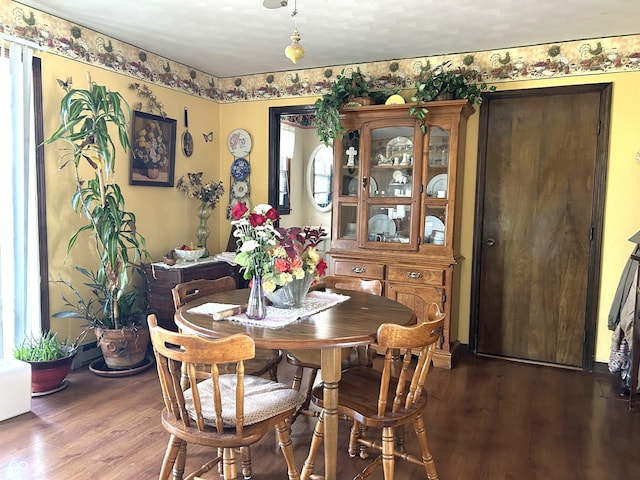 dining room with hardwood / wood-style flooring