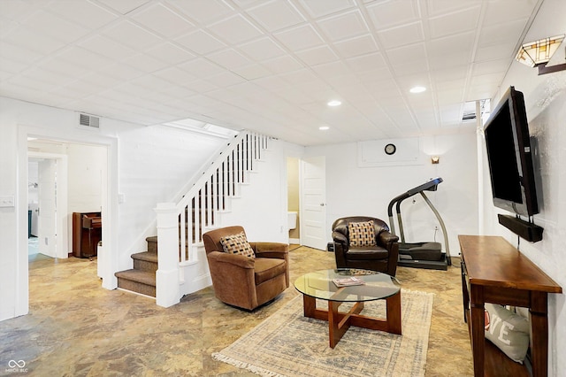 living room with stairs, visible vents, and recessed lighting