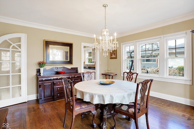 dining area with ornamental molding, dark wood-style flooring, baseboards, and an inviting chandelier