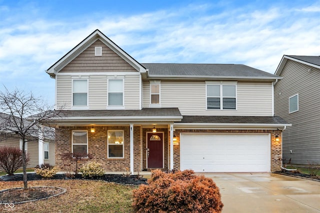 view of front of property featuring a garage and covered porch