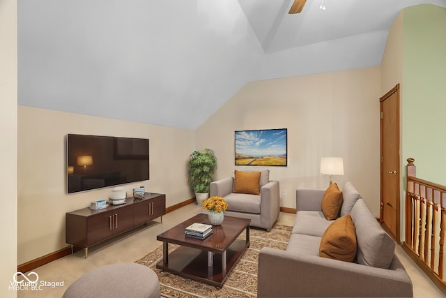 carpeted living room with ceiling fan and lofted ceiling