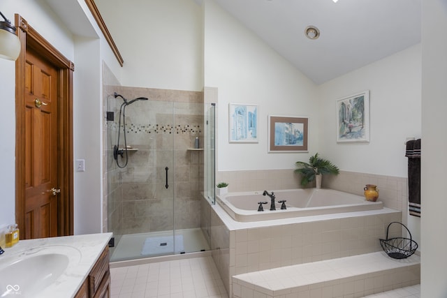 bathroom featuring lofted ceiling, vanity, and independent shower and bath