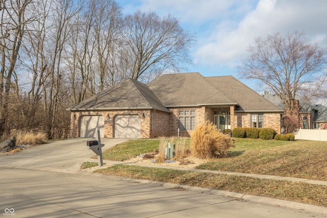 view of front facade with a garage and a front yard