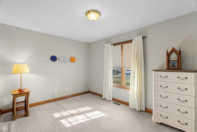 bedroom featuring light carpet