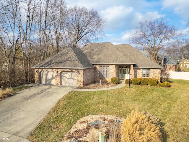 view of front of property featuring a garage and a front yard