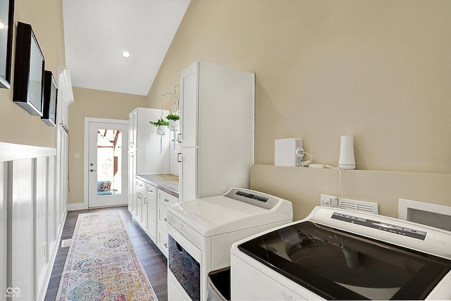 laundry room with cabinets, dark hardwood / wood-style flooring, and separate washer and dryer