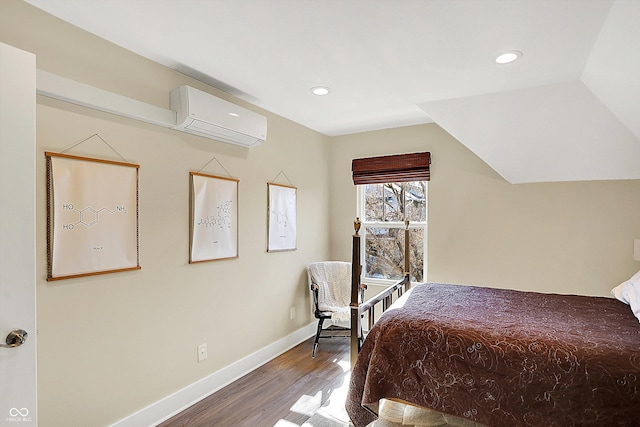 bedroom with lofted ceiling, a wall mounted air conditioner, and hardwood / wood-style floors