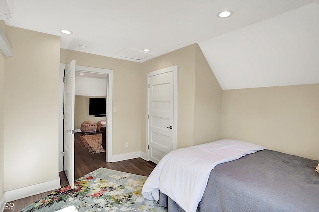 bedroom with lofted ceiling and dark wood-type flooring