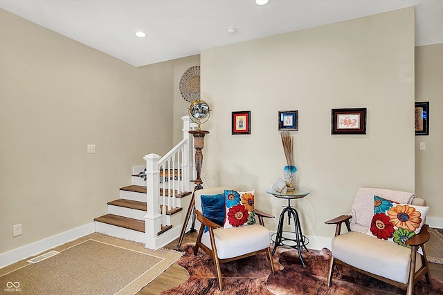 staircase featuring hardwood / wood-style floors