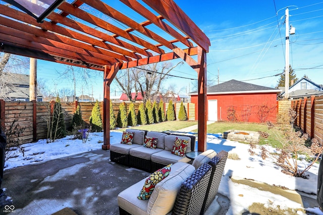 snow covered patio featuring an outdoor living space with a fire pit and a pergola