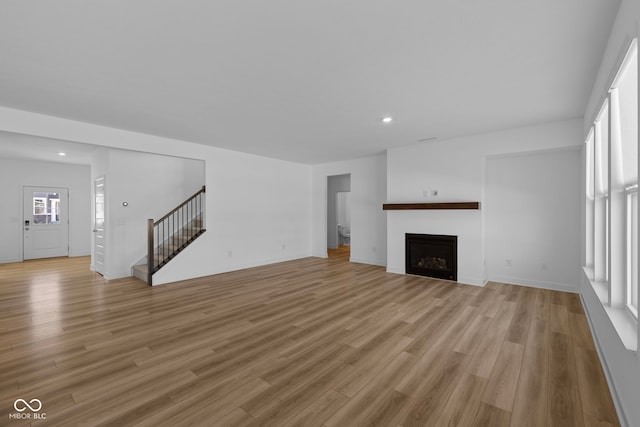 unfurnished living room featuring light hardwood / wood-style floors