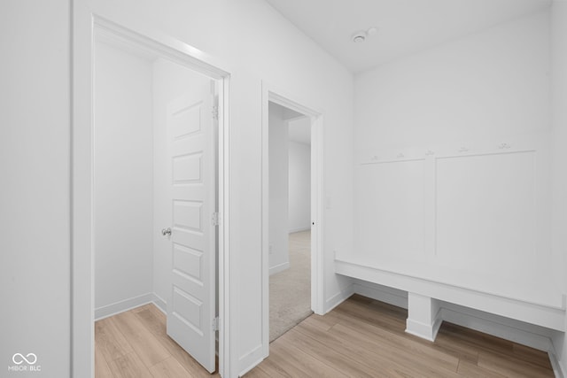 hallway with light wood-type flooring