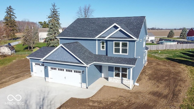 view of front of house with a garage and a front yard