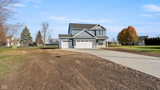 view of front facade with a garage and a front yard