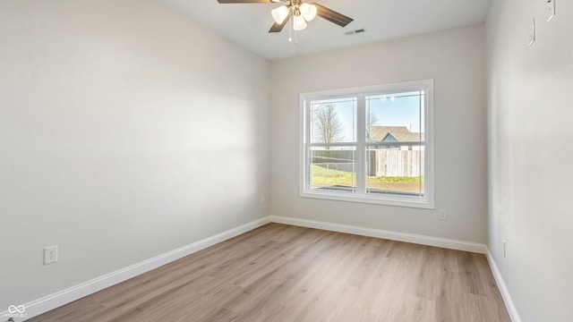 spare room with ceiling fan and light hardwood / wood-style flooring