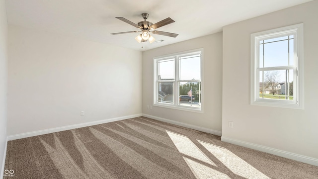 carpeted empty room with ceiling fan