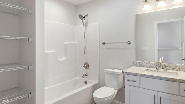 full bathroom with vanity, bathtub / shower combination, and toilet