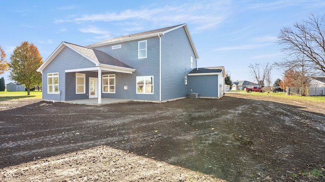 back of house with central AC and a patio area