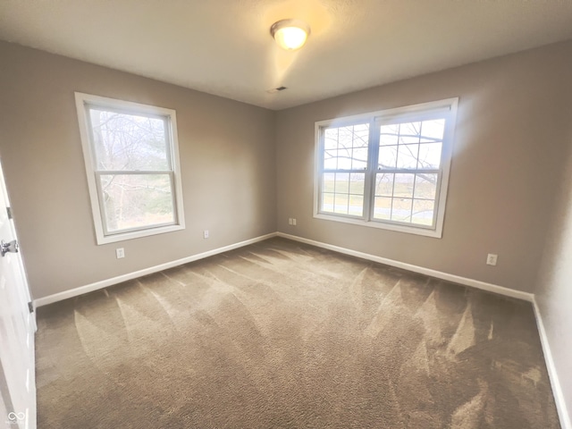 view of carpeted spare room