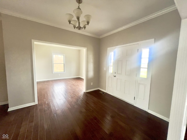 entryway featuring a notable chandelier, ornamental molding, and dark hardwood / wood-style floors