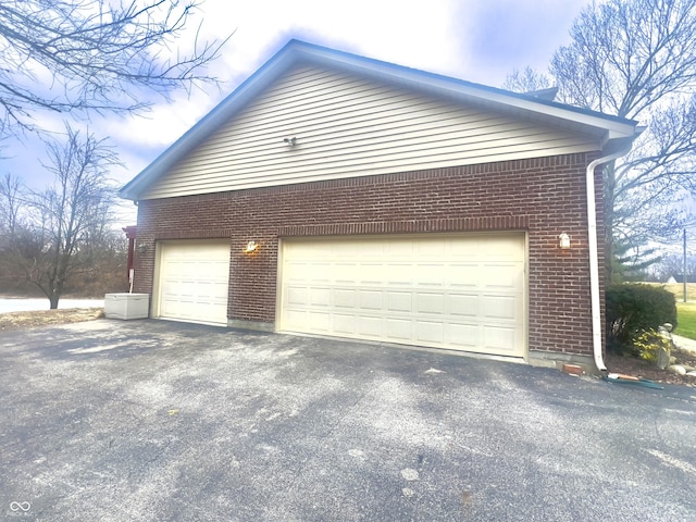 view of property exterior featuring a garage