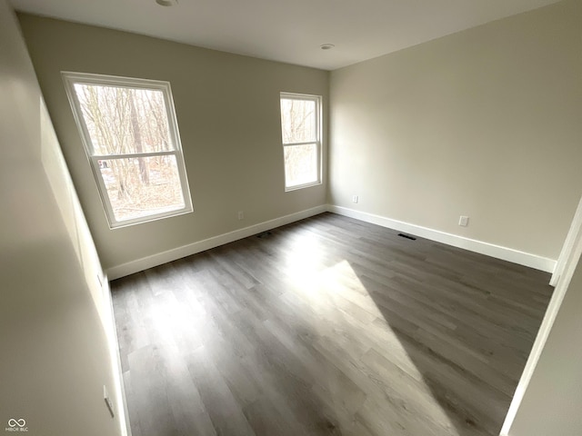 empty room featuring dark hardwood / wood-style floors