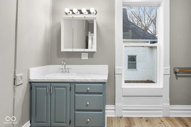 bathroom with vanity and hardwood / wood-style floors