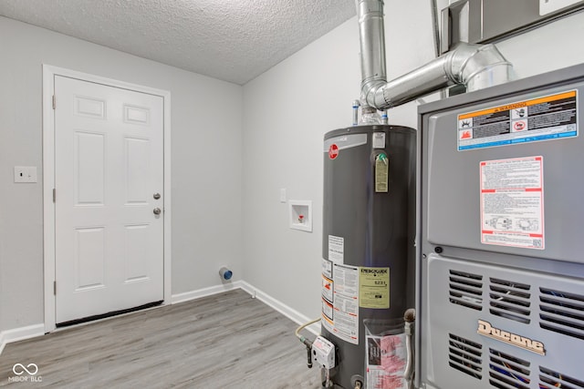 utility room with heating unit and water heater