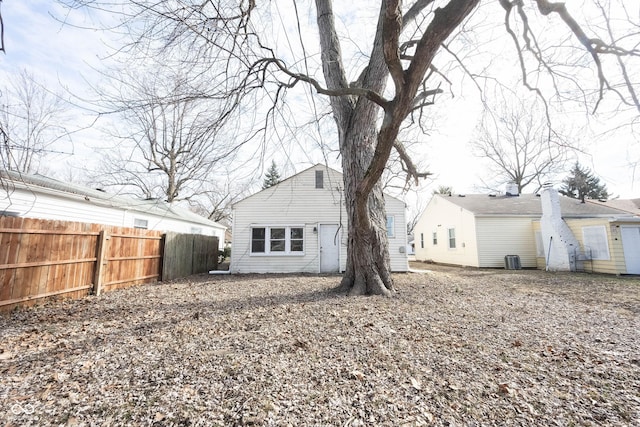 back of house featuring central air condition unit