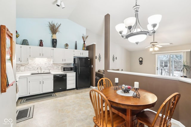 dining space featuring a ceiling fan and lofted ceiling