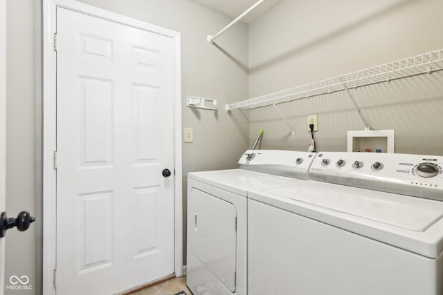 clothes washing area with laundry area and separate washer and dryer