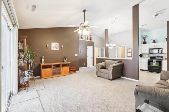 living area featuring visible vents, light carpet, high vaulted ceiling, baseboards, and ceiling fan with notable chandelier