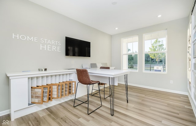 office area with light hardwood / wood-style flooring