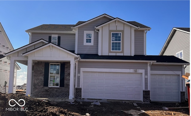 view of front facade featuring brick siding and an attached garage