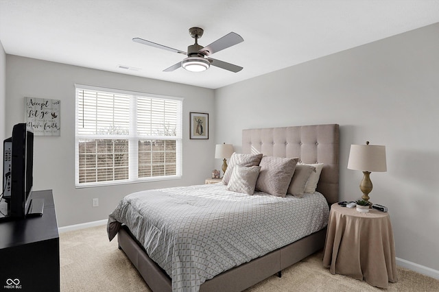 bedroom with light colored carpet and ceiling fan