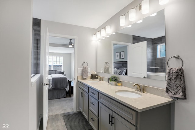 bathroom featuring vanity, hardwood / wood-style floors, and ceiling fan