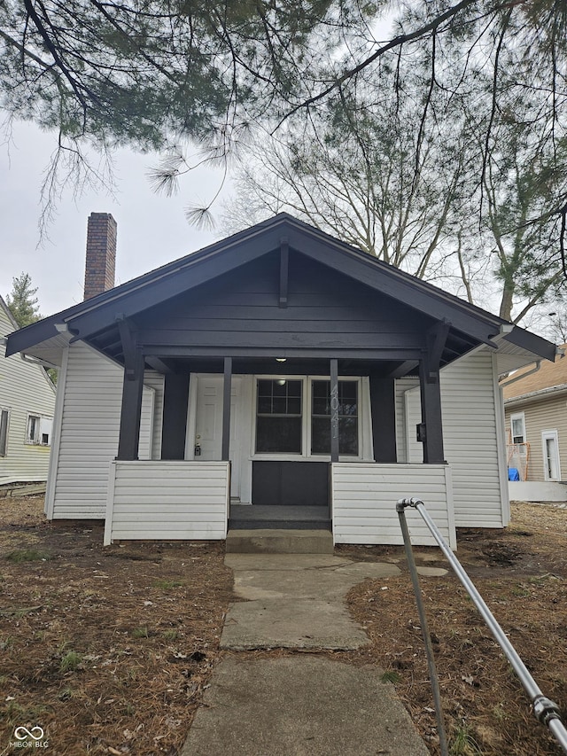 bungalow-style house featuring covered porch