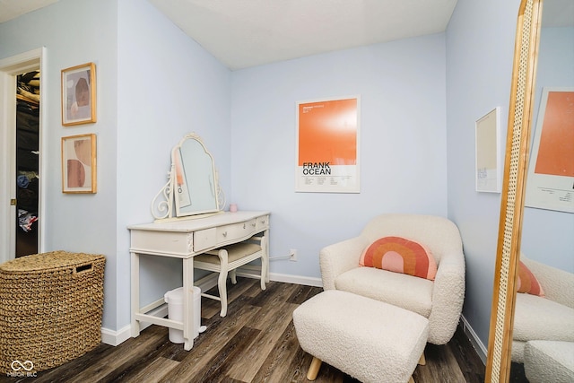 sitting room featuring dark wood-type flooring