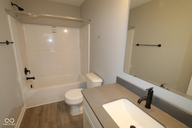 full bathroom featuring vanity, shower / bath combination, wood finished floors, and toilet