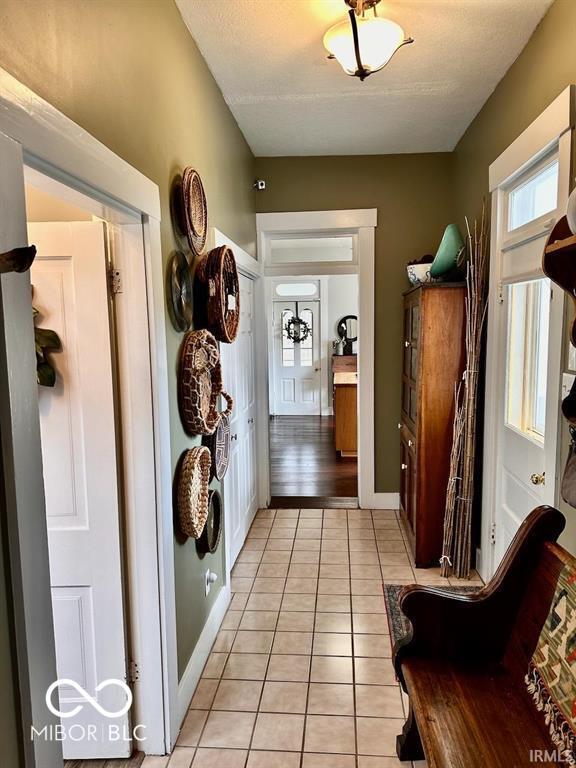 12801 E Edgewater Rd, Albany, IN 47320 - hallway with light tile patterned floors