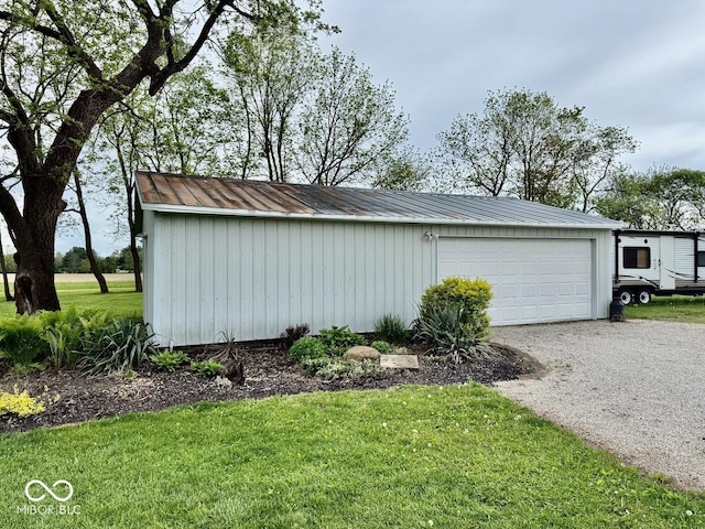 12801 E Edgewater Rd, Albany, IN 47320 - view of side of home with an outbuilding, driveway, metal roof, a lawn, and board and batten siding