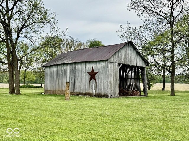 12801 E Edgewater Rd, Albany, IN 47320 - view of pole building with a lawn