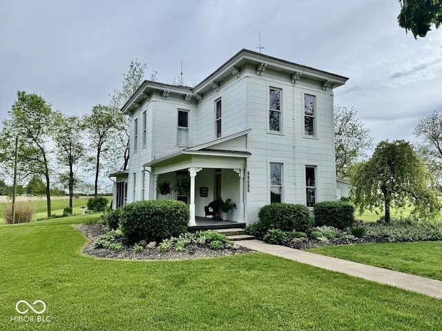 12801 E Edgewater Rd, Albany, IN 47320 - italianate home featuring a front yard and a porch